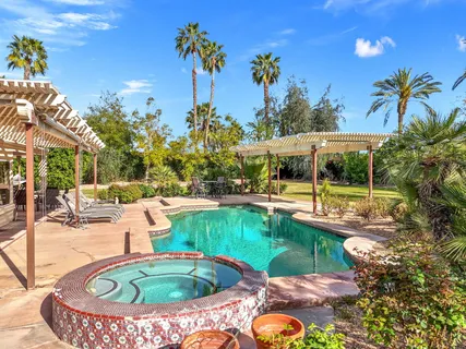 a living room with furniture a fireplace and a table