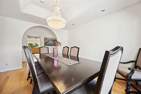 a bathroom with a granite countertop sink a large mirror and vanity