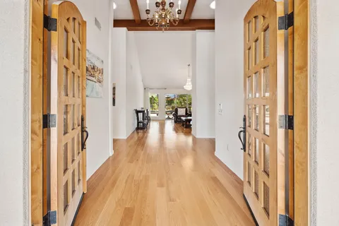 a living room with furniture kitchen view and a fireplace