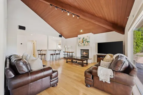 a spacious bedroom with a bed and a couch