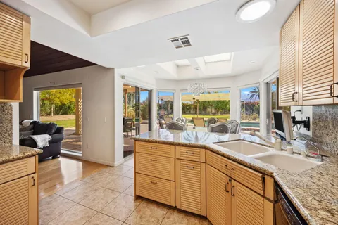 a spacious bathroom with a granite countertop tub and a sink