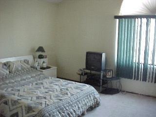 1736 Kerry Lane Santa Rosa, CA 95403 - Photo 5 of 5 a bedroom with a bed and a tv on table