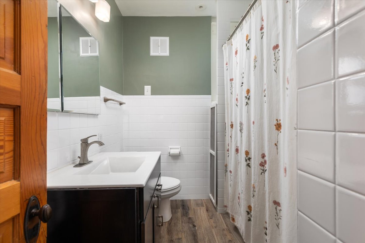 23 Columbia Street Naperville, IL 60540 - Photo 53 of 94 a bathroom with a sink a toilet and shower