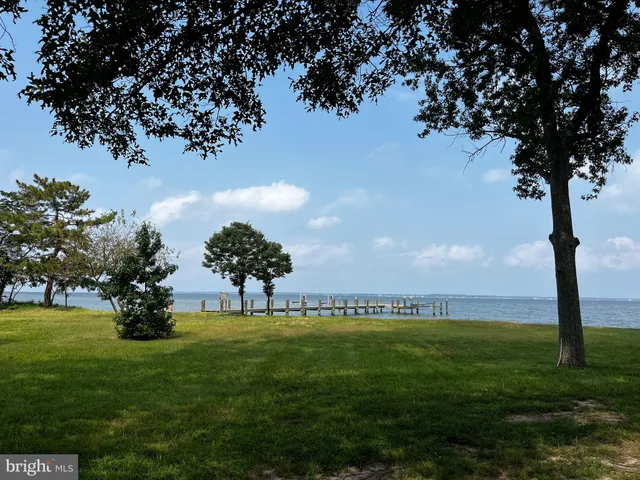 a view of a lake with a big yard