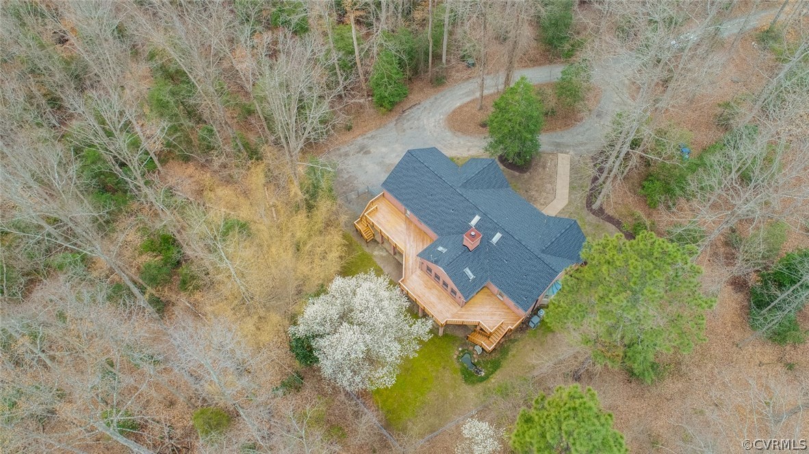 an aerial view of house with yard