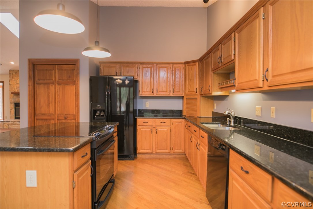4002 Fraley Court Mechanicsville, VA 23111 - Photo 12 of 49 a kitchen with granite countertop a sink stove and refrigerator