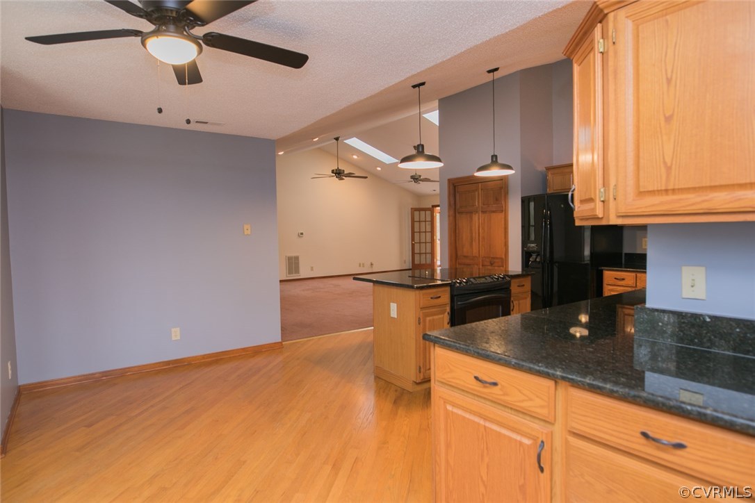 4002 Fraley Court Mechanicsville, VA 23111 - Photo 13 of 49 a kitchen with stainless steel appliances granite countertop a sink a stove and a microwave oven