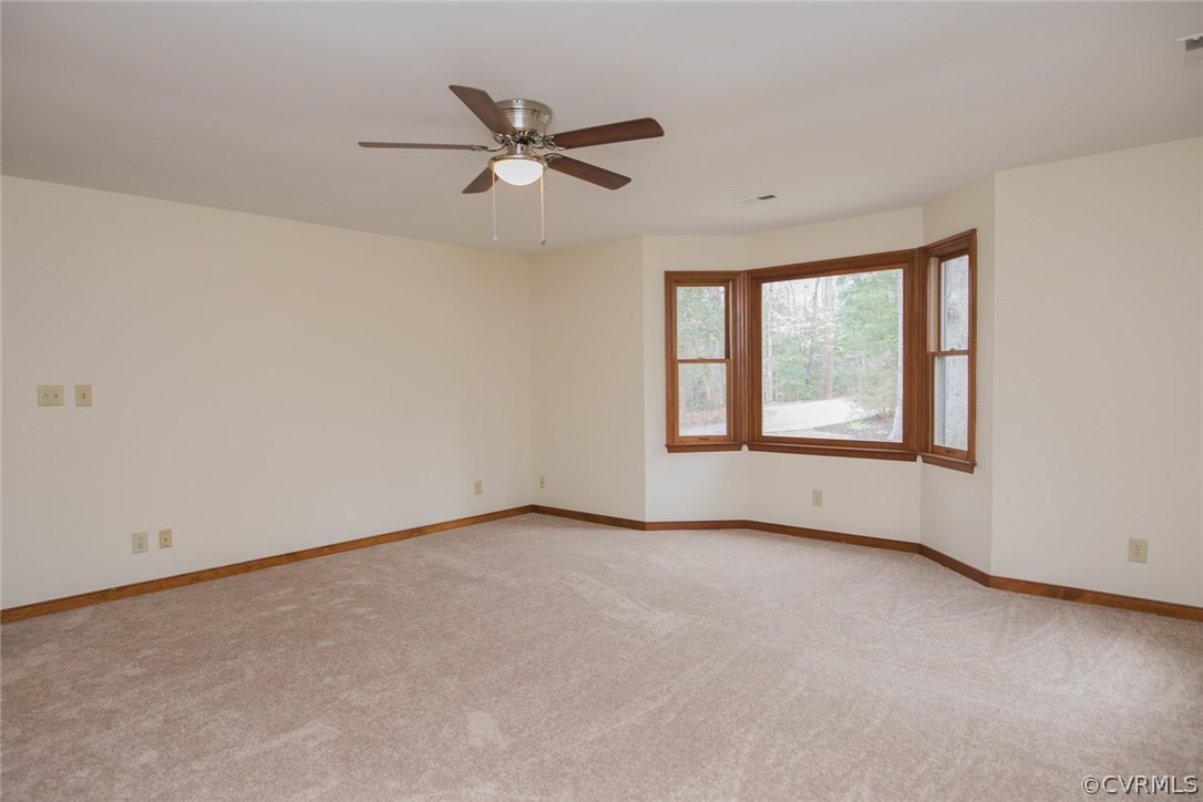 4002 Fraley Court Mechanicsville, VA 23111 - Photo 20 of 49 an empty room with windows and fan