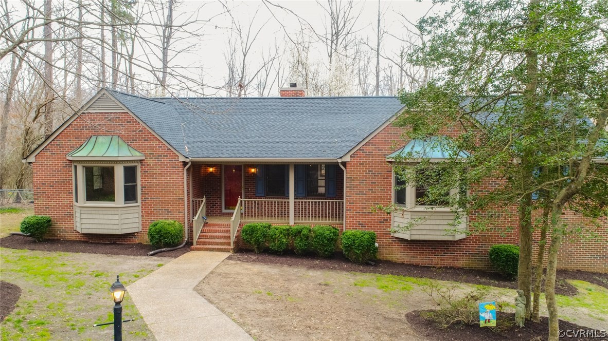 4002 Fraley Court Mechanicsville, VA 23111 - Photo 2 of 49 a front view of a house with a yard and garage