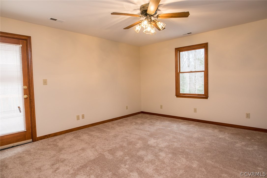 4002 Fraley Court Mechanicsville, VA 23111 - Photo 25 of 49 an empty room with windows and fan