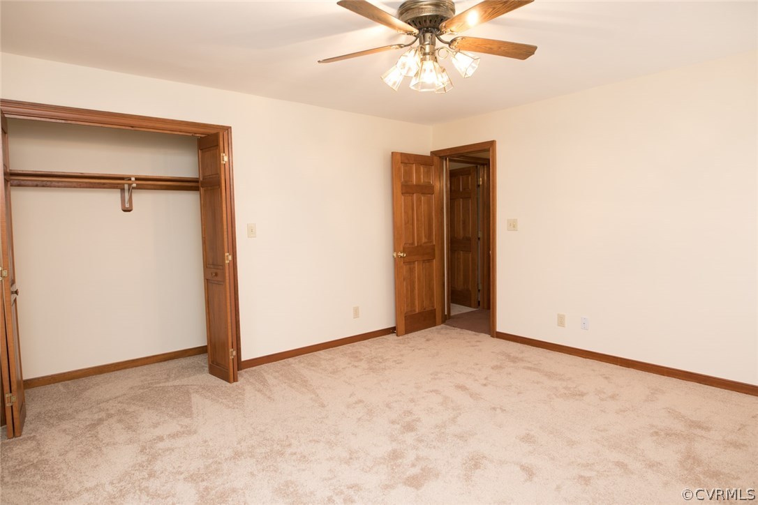 4002 Fraley Court Mechanicsville, VA 23111 - Photo 26 of 49 an empty room with a ceiling fan and a window