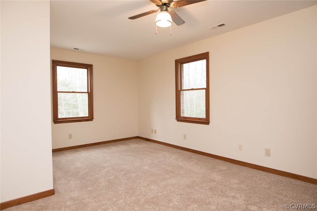 4002 Fraley Court Mechanicsville, VA 23111 - Photo 27 of 49 an empty room with a window and a ceiling fan