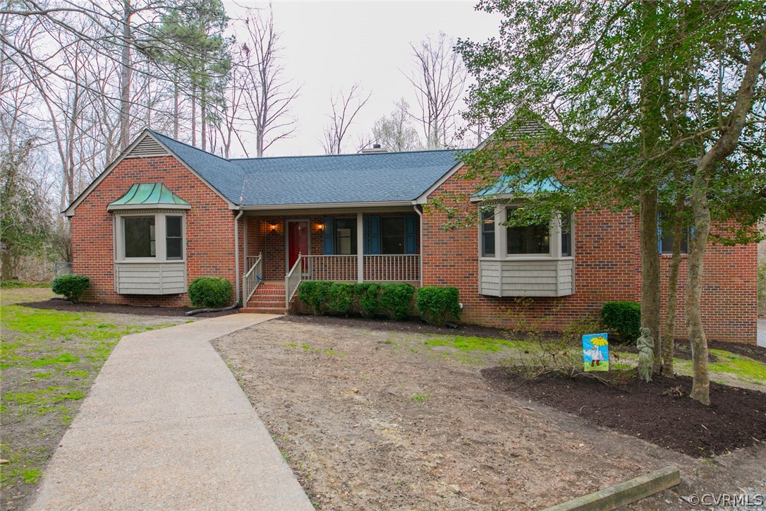 4002 Fraley Court Mechanicsville, VA 23111 - Photo 3 of 49 a front view of a house with a yard and trees