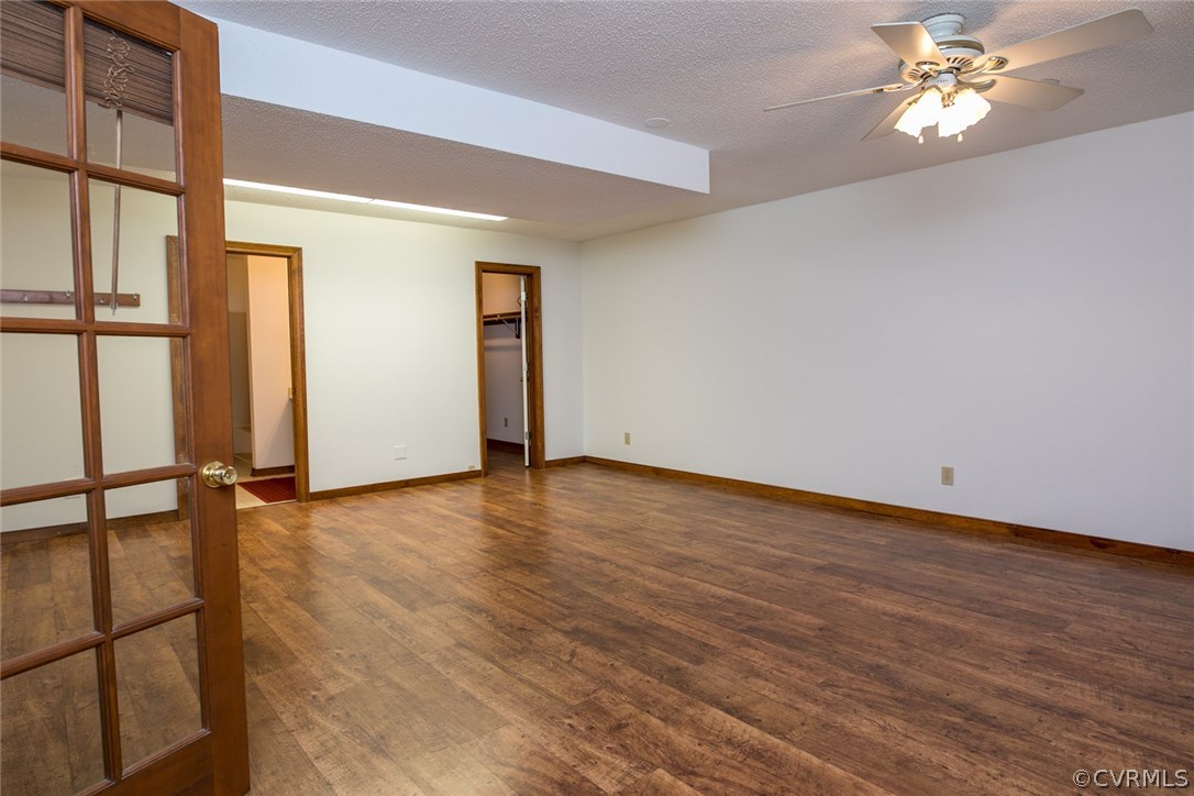 4002 Fraley Court Mechanicsville, VA 23111 - Photo 32 of 49 an empty room with wooden floor fan and windows