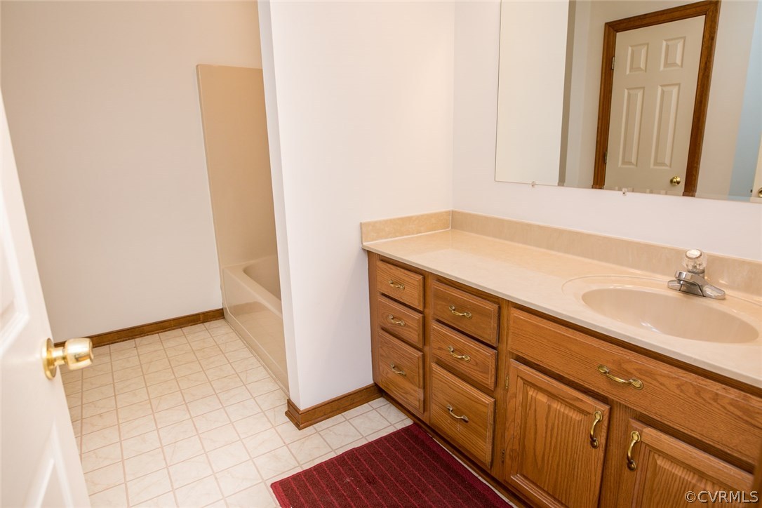 4002 Fraley Court Mechanicsville, VA 23111 - Photo 35 of 49 a bathroom with a sink and a mirror