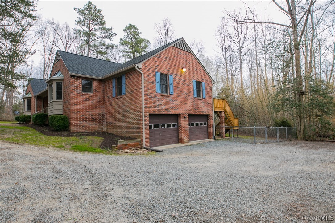 4002 Fraley Court Mechanicsville, VA 23111 - Photo 4 of 49 a front view of a house with a yard and garage