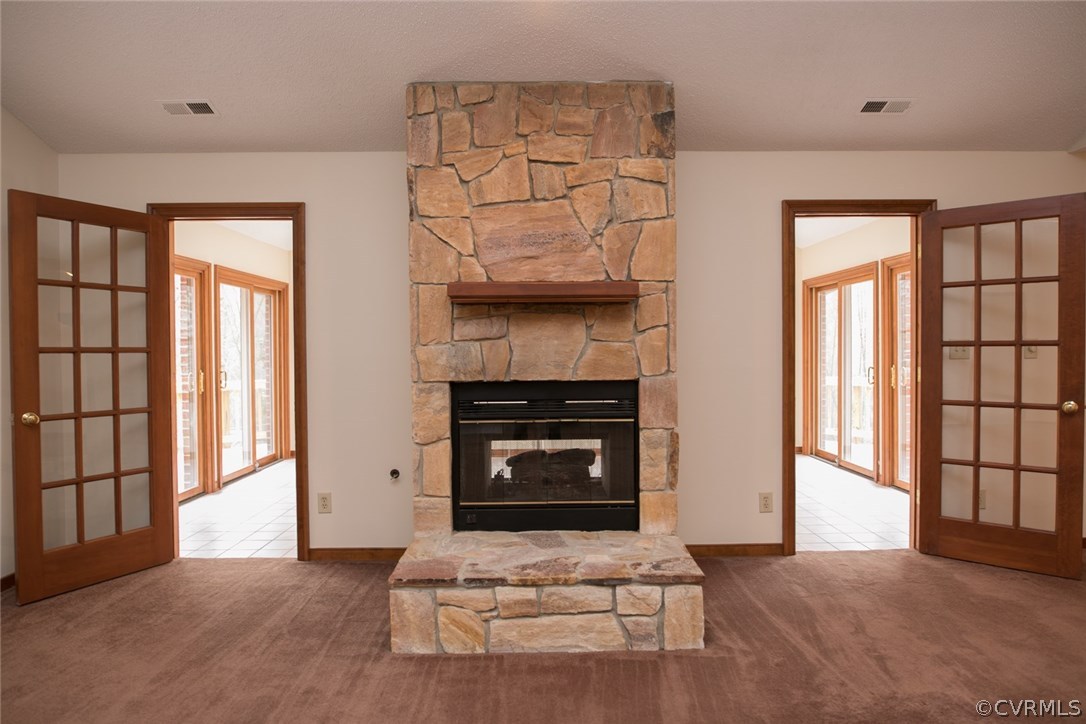 4002 Fraley Court Mechanicsville, VA 23111 - Photo 10 of 49 a living room with a fireplace and a flat screen tv