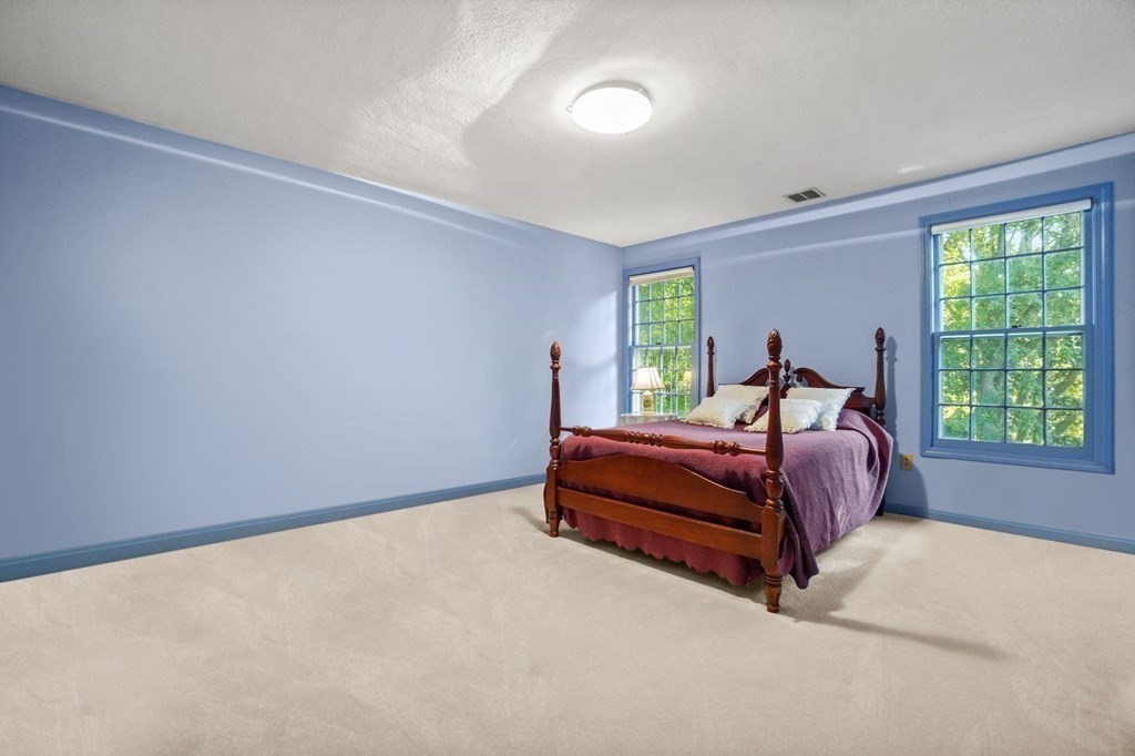 209 East Emerson Road Lexington, MA 02420 - Photo 23 of 37 a bedroom with a bed and window