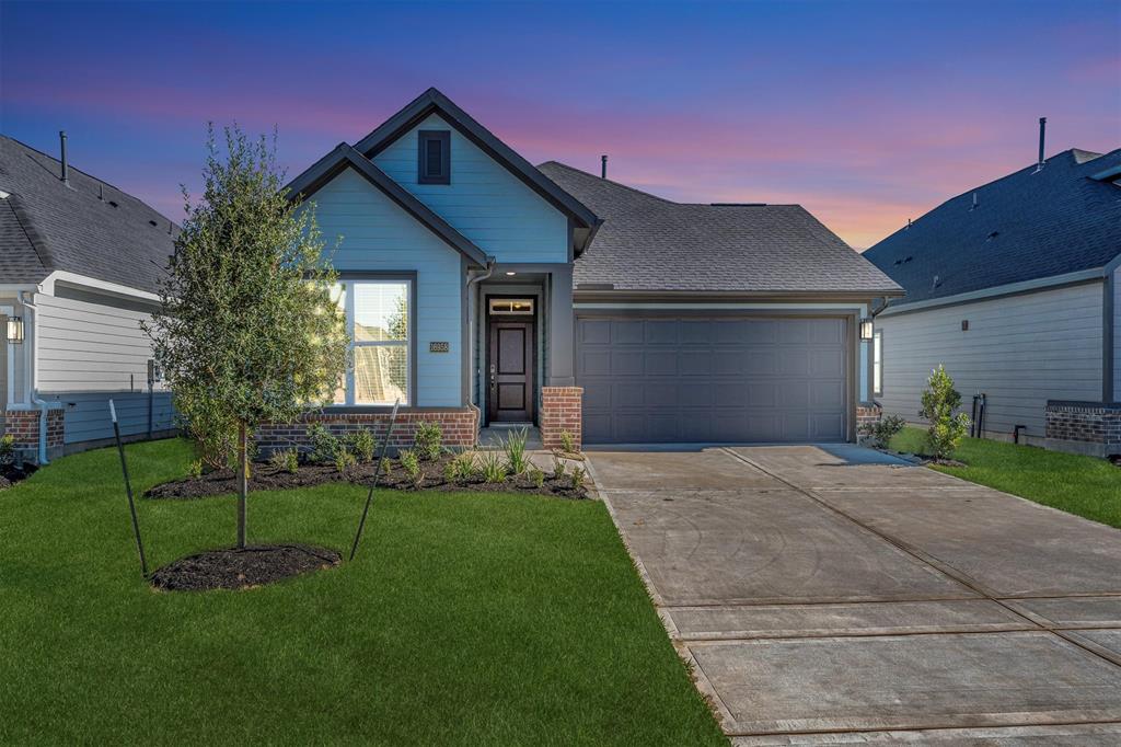 16018 Bishops Cap Way Cypress, TX 77429 - Photo 1 of 50 a front view of a house with a yard