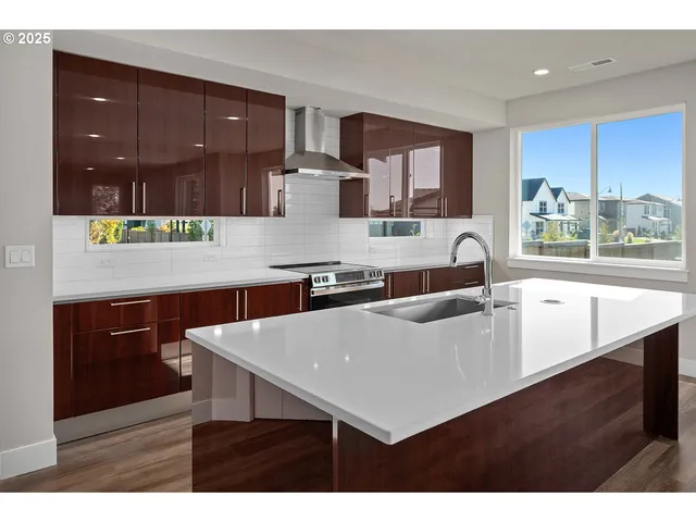 a kitchen with a sink cabinets and window