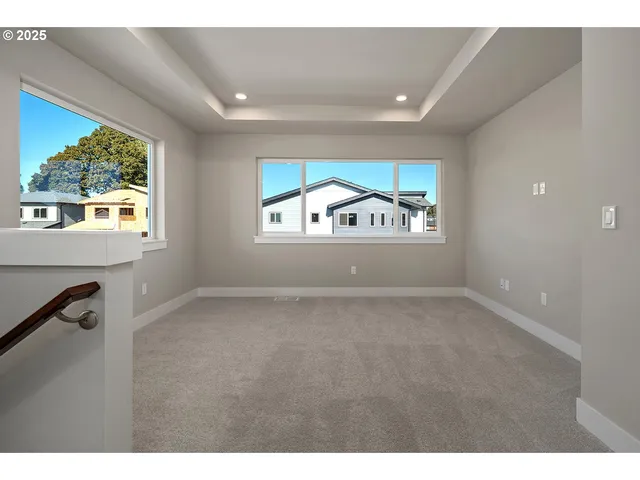 a view of empty room with windows