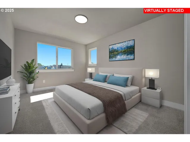 a bedroom with a bed and a potted plant