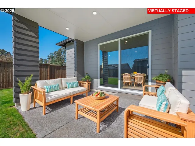 a outdoor living space with furniture and a potted plant