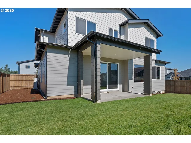 a view of a house with a yard and stairs