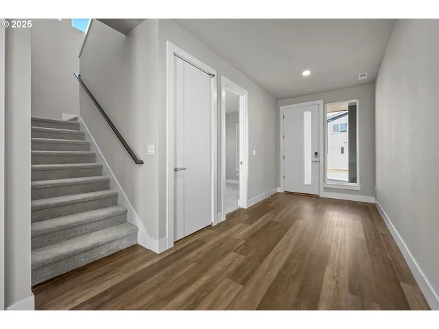 a view of entryway with wooden floor