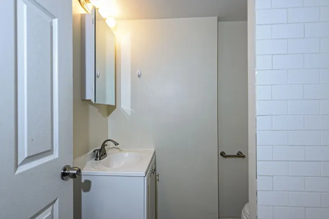 a bathroom with a sink and mirror