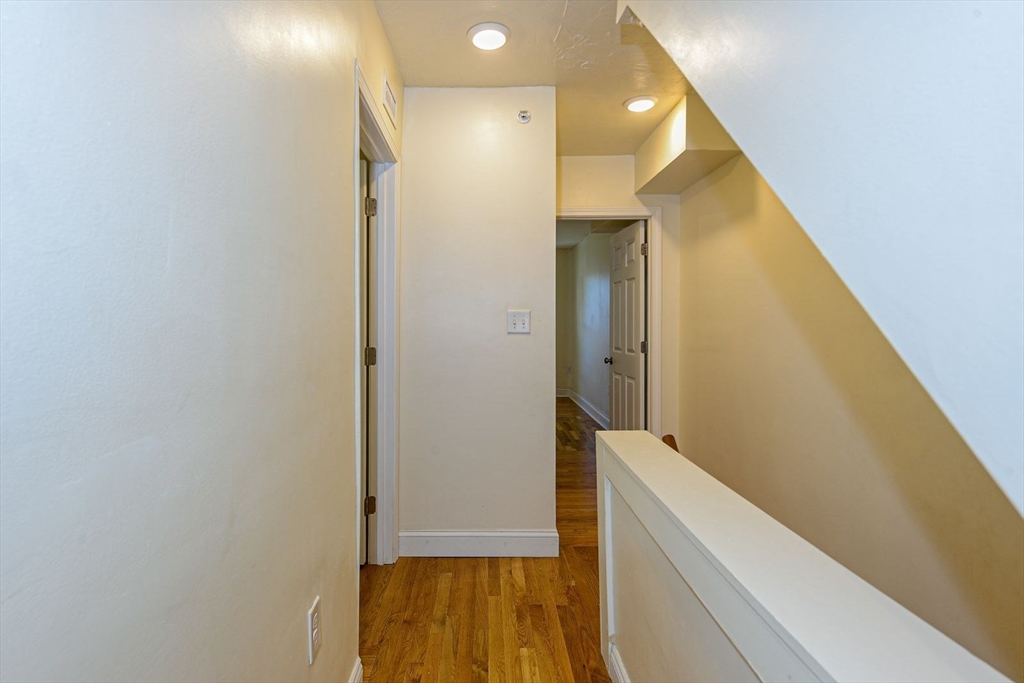 2 Mechanic Street, Unit 1 Newton, MA 02464 - Photo 8 of 14 a view of hallway with wooden floor