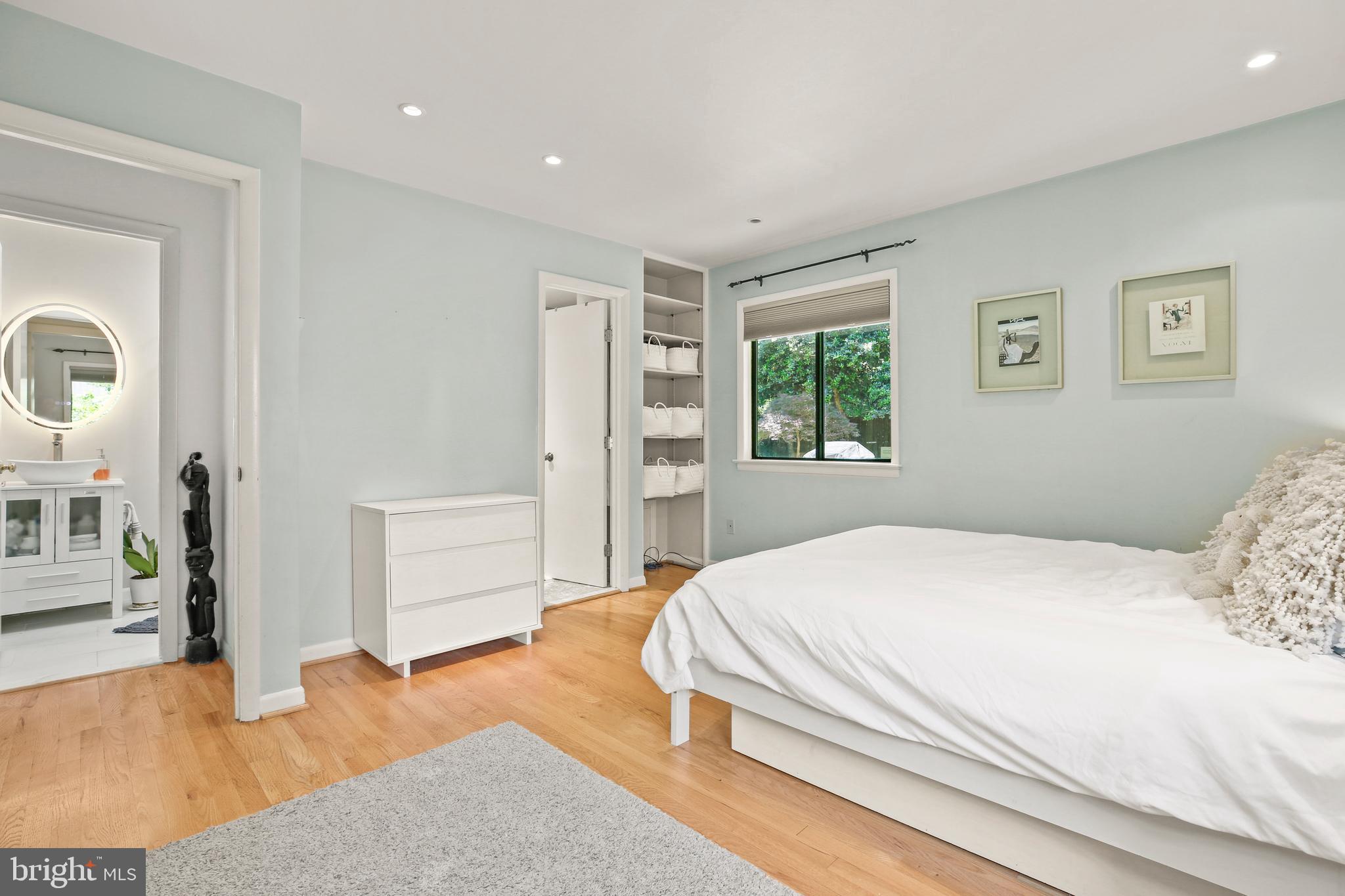 11212 Angus Place Potomac, MD 20854 - Photo 20 of 42 a bedroom with a large bed and a window