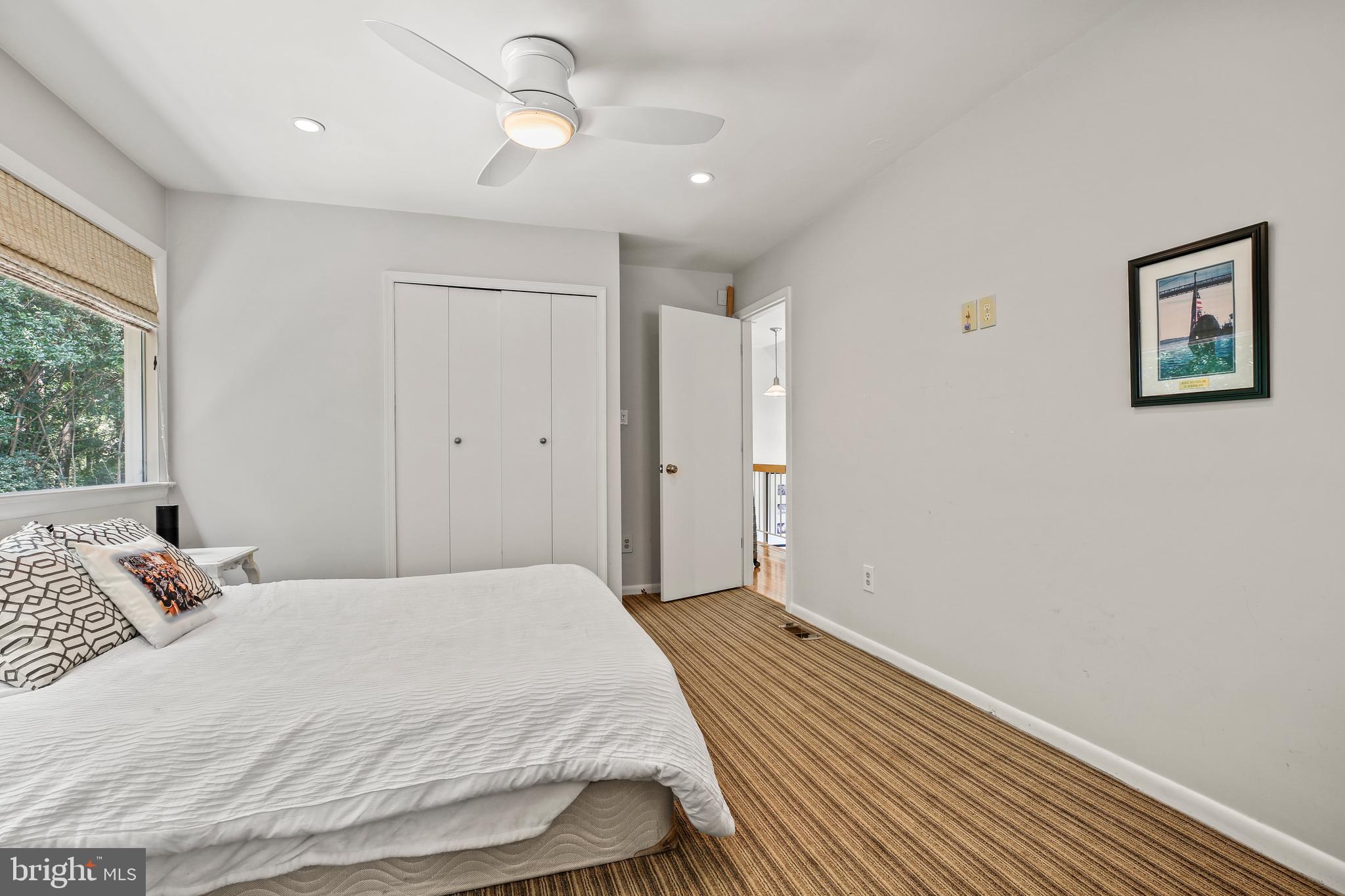 11212 Angus Place Potomac, MD 20854 - Photo 29 of 42 a bedroom with a bed and a window