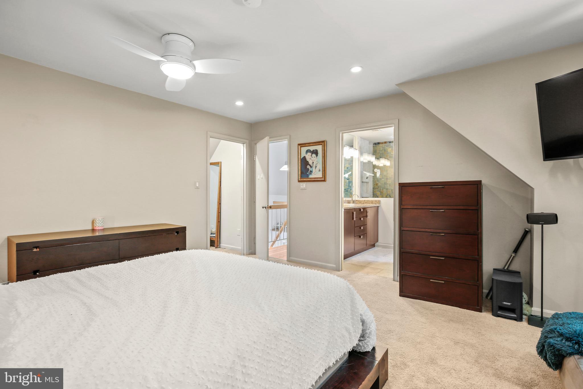 11212 Angus Place Potomac, MD 20854 - Photo 31 of 42 a bedroom with a bed and a television