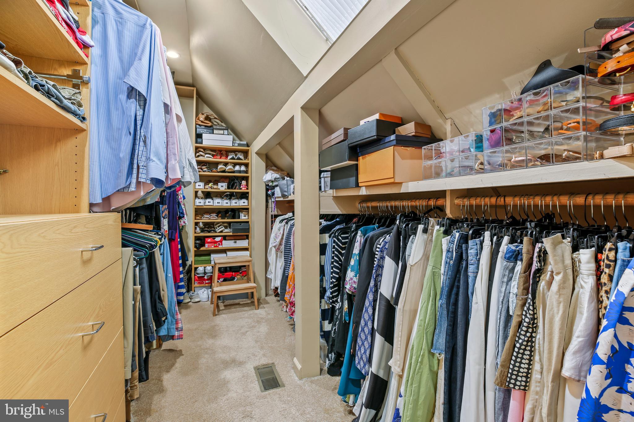 11212 Angus Place Potomac, MD 20854 - Photo 33 of 42 a view of walk in closet with clothes and shoes
