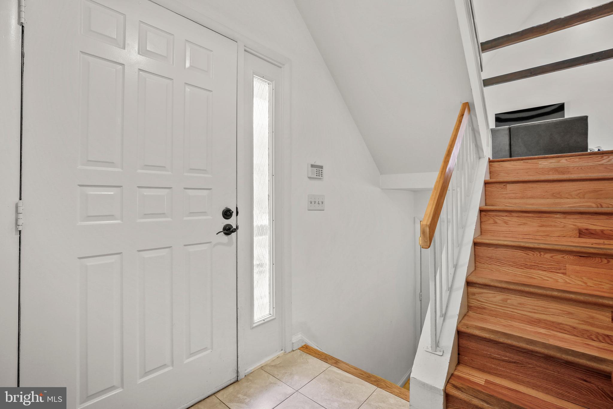 11212 Angus Place Potomac, MD 20854 - Photo 4 of 42 a view of entryway with wooden floor