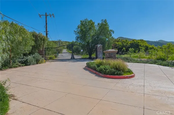 a view of a swimming pool with a yard
