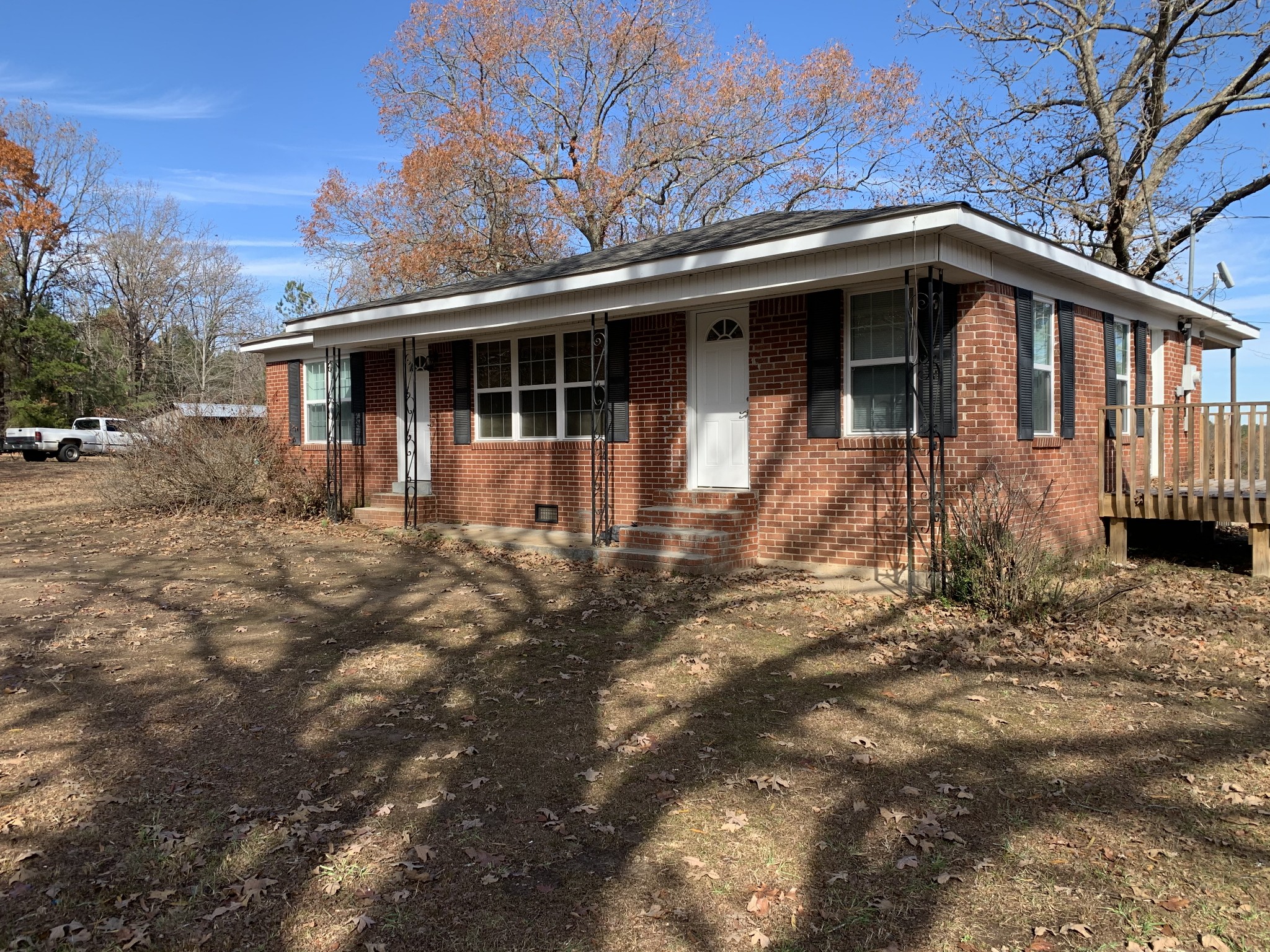 881 Russom Road Finger, TN 38334 - Photo 1 of 61 a front view of a house with yard and trees around