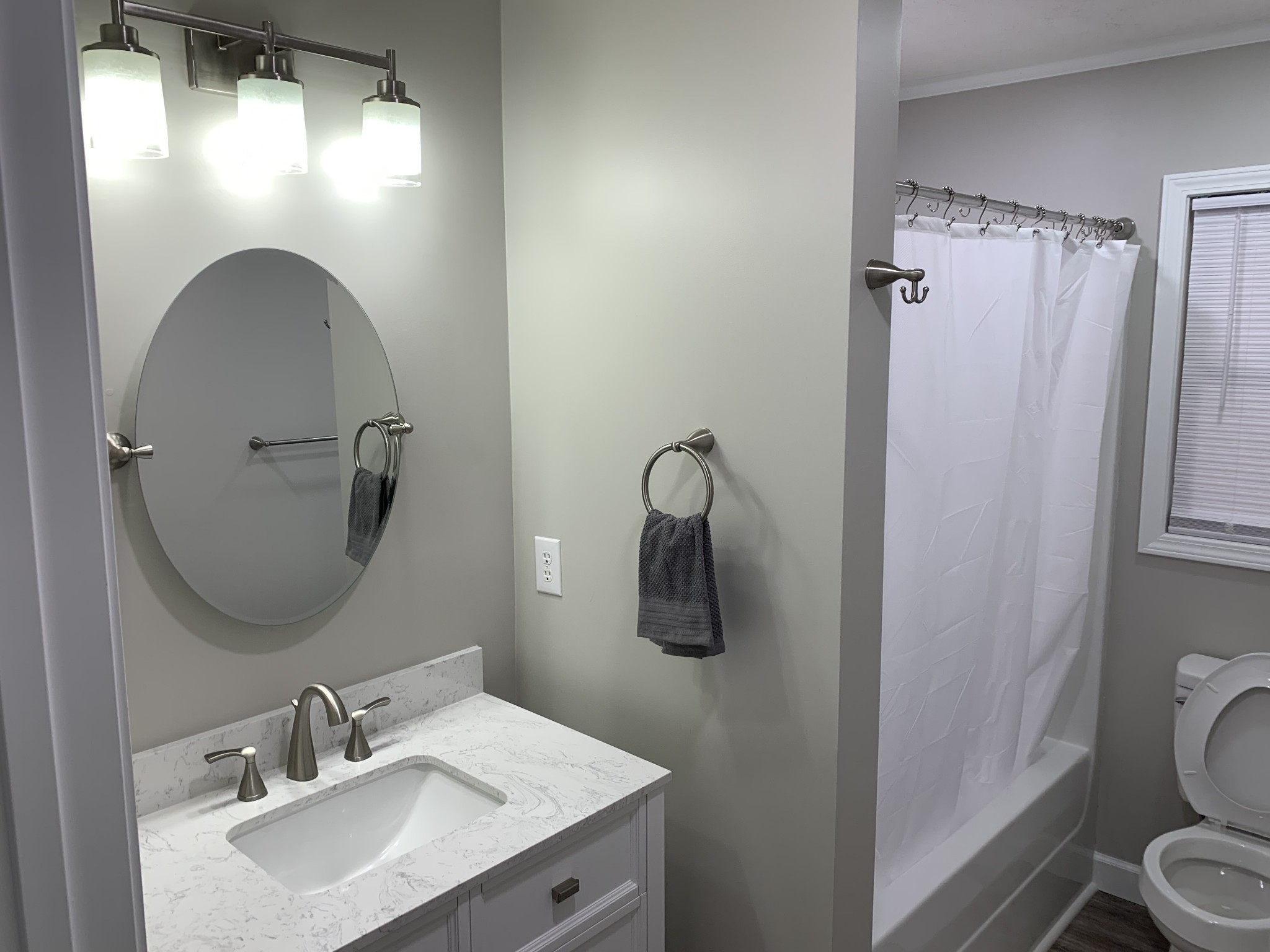 881 Russom Road Finger, TN 38334 - Photo 23 of 61 a bathroom with a sink toilet and shower a mirror