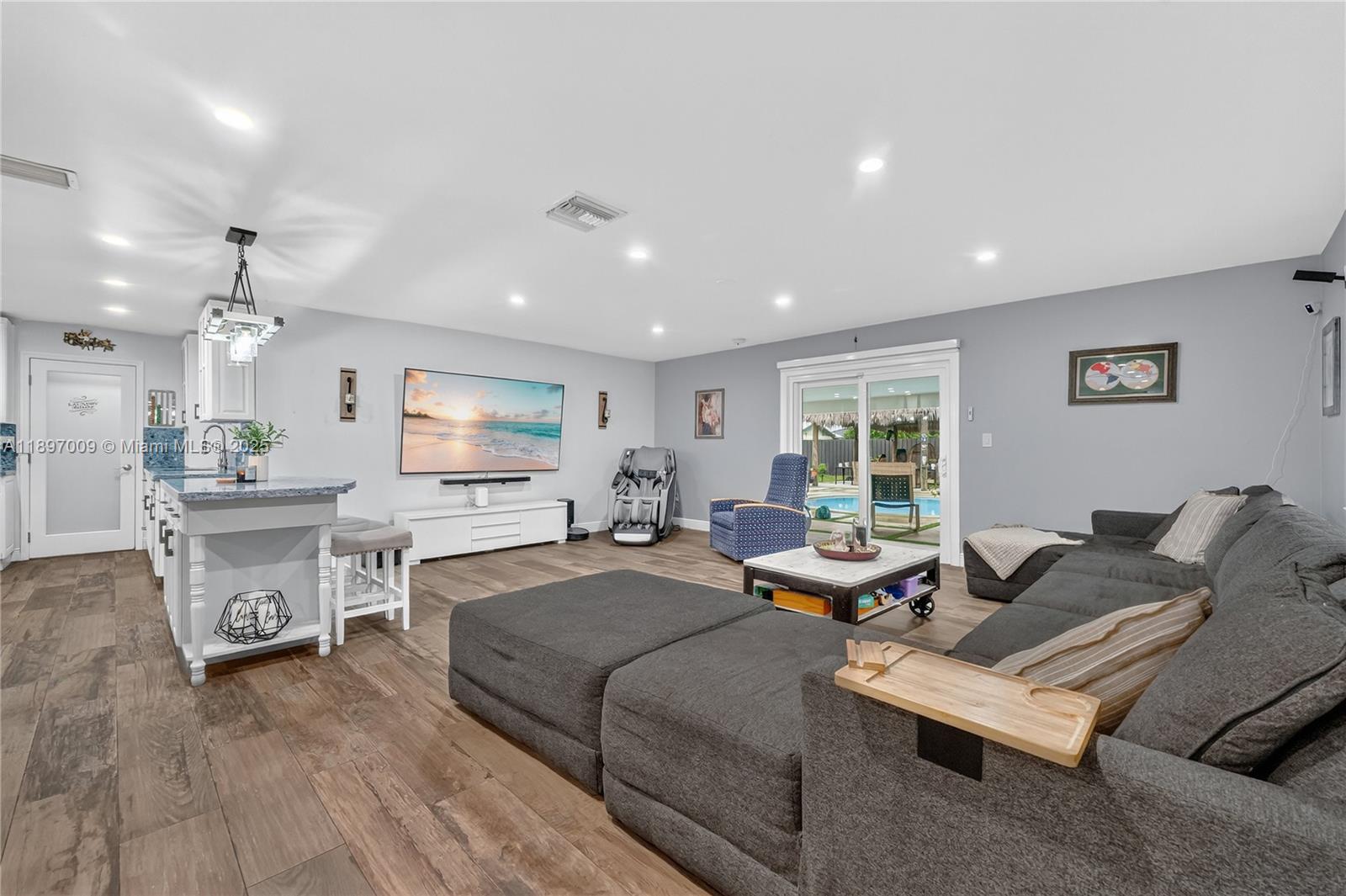 32020 Southwest 199th Avenue Homestead, FL 33030 - Photo 12 of 43 a living room with furniture and a wooden floor