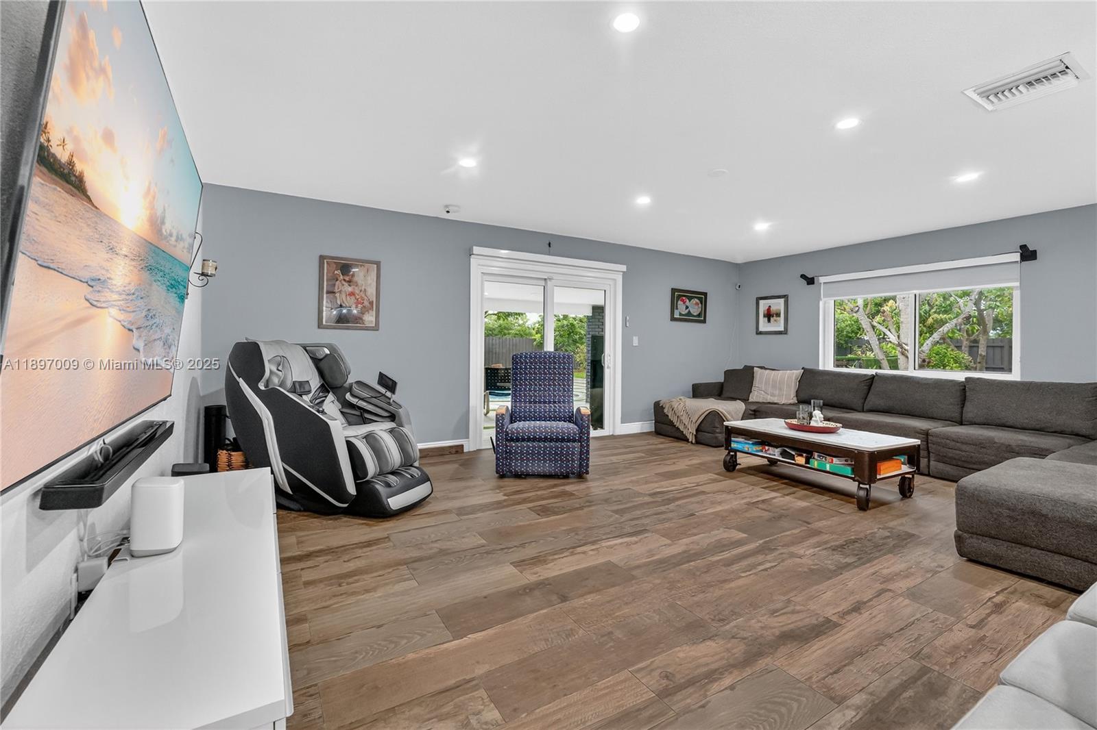32020 Southwest 199th Avenue Homestead, FL 33030 - Photo 13 of 43 a living room with furniture and a window