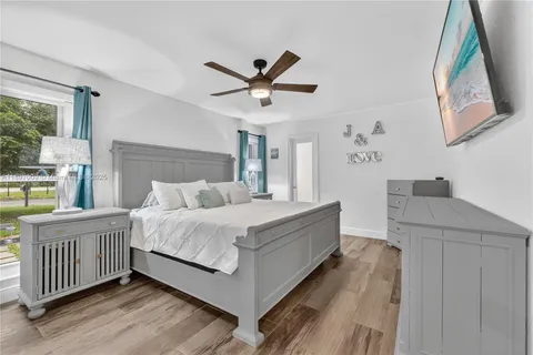 a bed room with a bed and a window