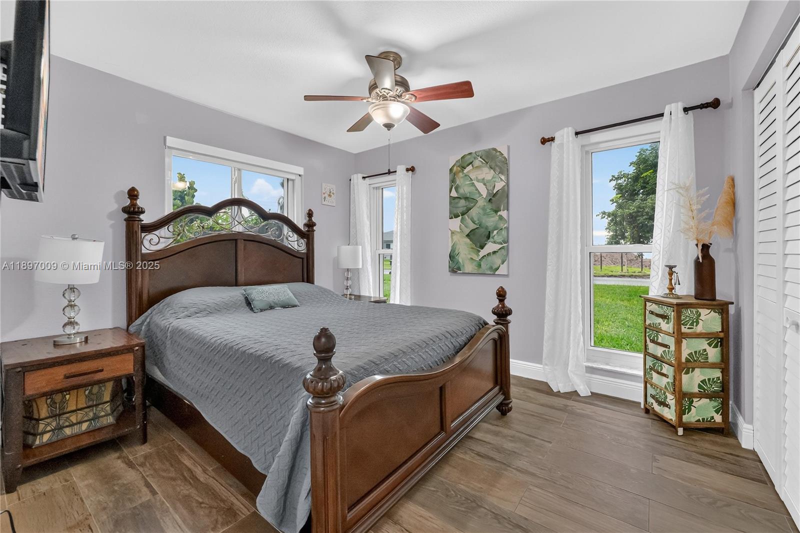 32020 Southwest 199th Avenue Homestead, FL 33030 - Photo 20 of 43 a bed sitting in a bedroom next to a window