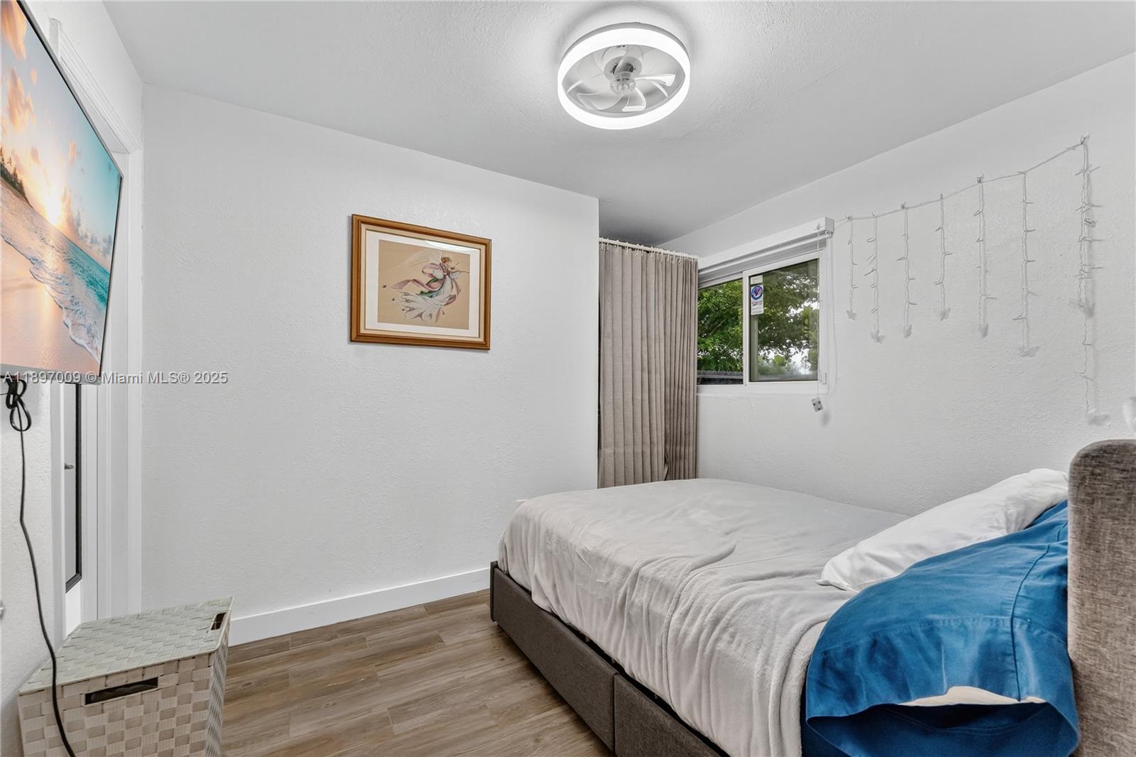 32020 Southwest 199th Avenue Homestead, FL 33030 - Photo 24 of 43 a bedroom with a bed and a window