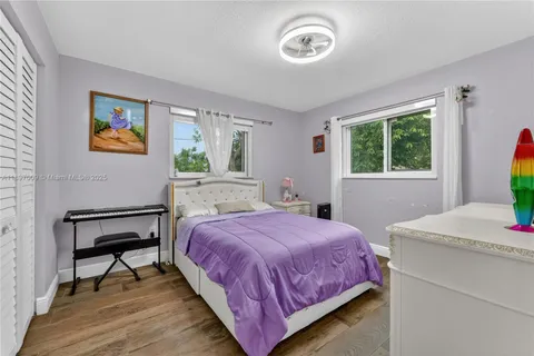 a bedroom with a bed and a table