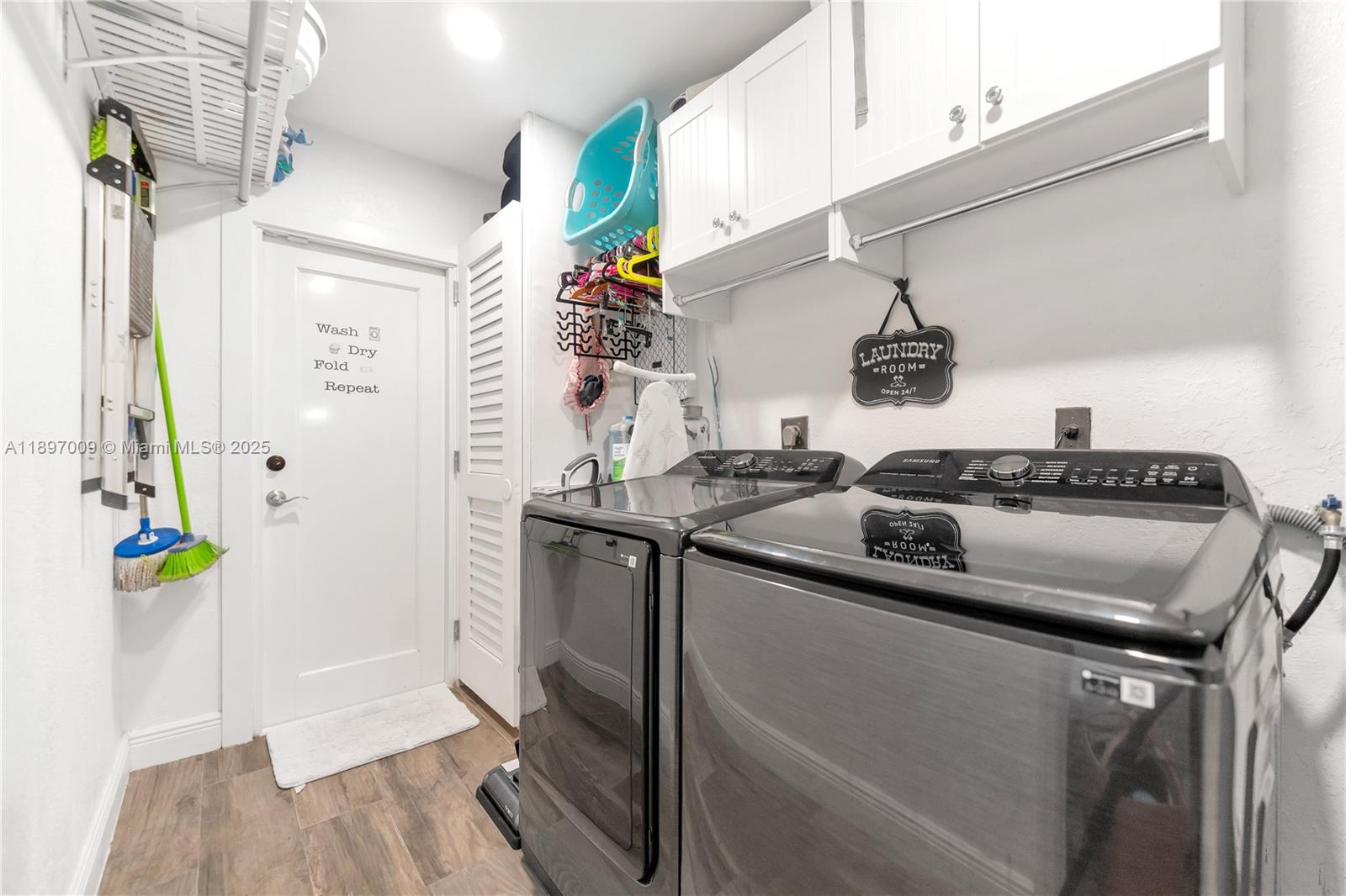 32020 Southwest 199th Avenue Homestead, FL 33030 - Photo 27 of 43 a kitchen that has a sink and a stove