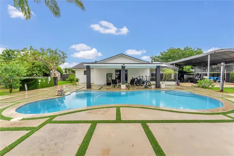 a view of a swimming pool with a patio