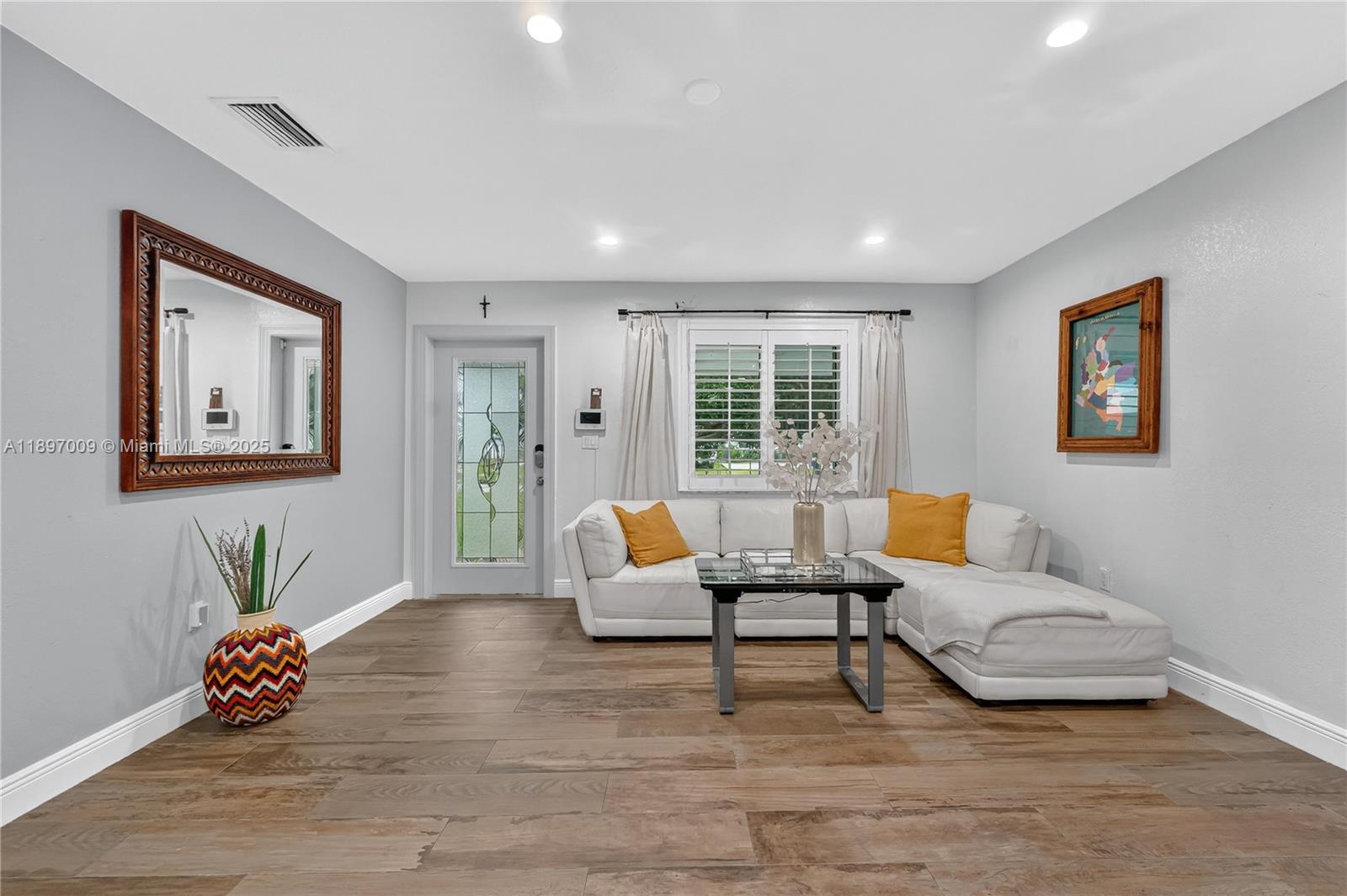 32020 Southwest 199th Avenue Homestead, FL 33030 - Photo 3 of 43 a living room with furniture and wooden floor