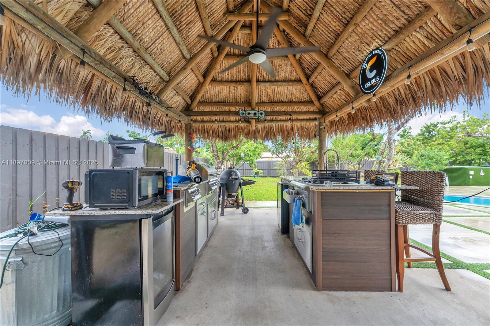 32020 Southwest 199th Avenue Homestead, FL 33030 - Photo 33 of 43 a view of a chairs and table in a patio