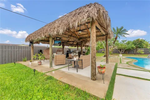 a view of a swimming pool with a patio